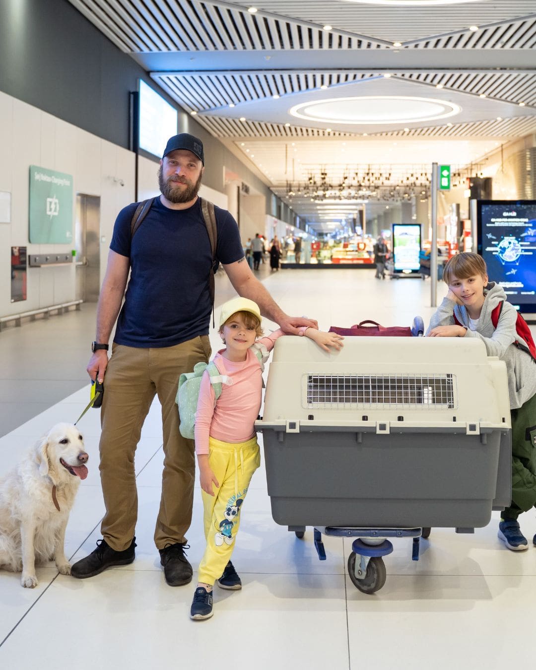 Family with big dog in airport. Family with big dog in airport.